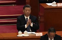 Chinese President Xi Jinping applauds during a session of China's National People's Congress (NPC) at the Great Hall of the People in Beijing, Sunday, March 12, 2023.