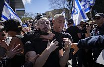 Israeli police scuffle with protesters during a protest.