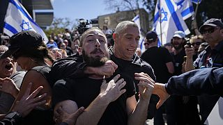 Israeli police scuffle with protesters during a protest.