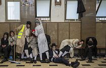 Ultra-Orthodox Jewish men celebrate after getting drunk during the Jewish holiday of Purim in Mea Shearim ultra-Orthodox neighborhood in Jerusalem, Wednesday, March 8, 2023.