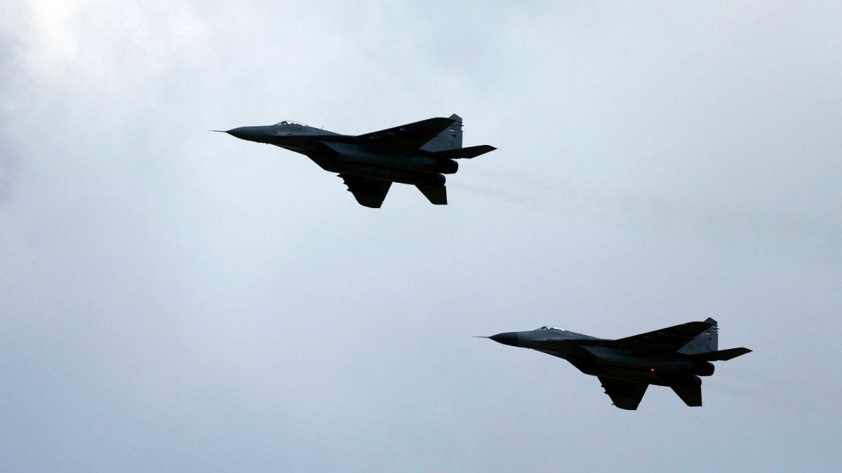 Serbian army MiG-29 jet fighters perform during the military exercises on Batajnica, military airport near Belgrade, Serbia, Saturday, April 30, 2022. 