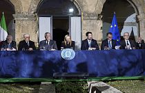 Italian Premier Giorgia Meloni, center, presides over a Cabinet session in Cutro's town council hall, southern Italy, Thursday, March 9, 2023. 