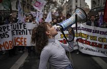 Students shout slogans during a protest in Lyon, central France, Thursday.