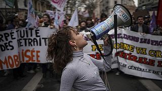 Students shout slogans during a protest in Lyon, central France, Thursday. 