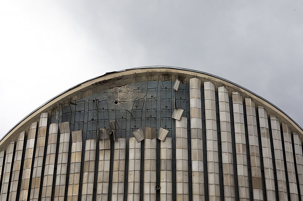 The view of the upper part of the local cinema building hit by a missile in February 2023. Kherson, Ukraine