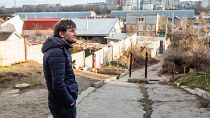 Kherson resident Roman stands in his neighbourhood in Kherson, Ukraine, 2023. Here he has been living with his family through Russian occupation of the city