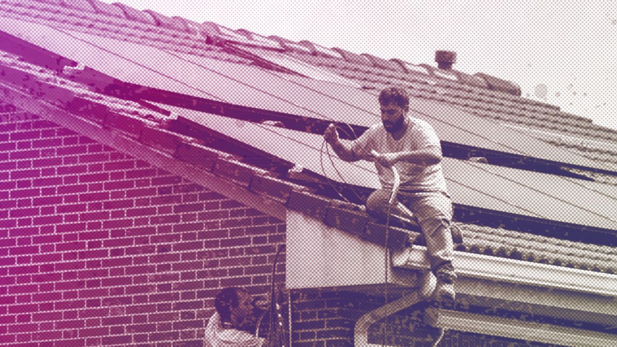 Workers install solar planers on the roof of a house in Rivas Vaciamadrid, September 2022