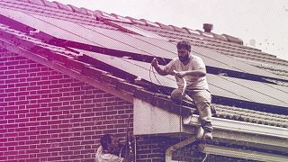 Workers install solar planers on the roof of a house in Rivas Vaciamadrid, September 2022