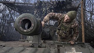 A Ukrainian paratrooper of the 80 Air Assault brigade prepares a self propelled howitzer 2s1 to fire towards Russian positions at the frontline near Bakhmut, March 10, 2023