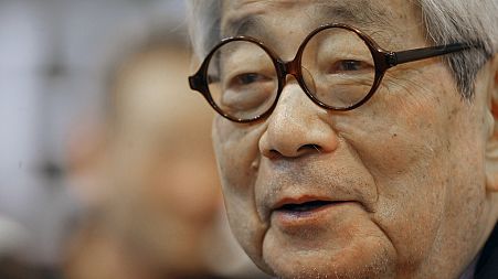 Japanese Nobel Prize winning author Kenzaburo Oe poses during the inauguration of the 32nd Paris Book Fair, which focused on Japanese writers, March 15, 2012.