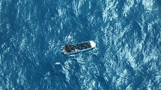 This image provided by German humanitarian organisation Sea-watch shows a boat carrying a group of migrants in distress in the Southern Mediterranean Sea, Saturday March 11, 2