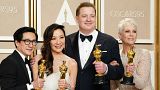 Ke Huy Quan, from left, Michelle Yeoh, Brendan Fraser and Jamie Lee Curtis pose with their awards in the press room at the Oscars