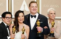 Ke Huy Quan, from left, Michelle Yeoh, Brendan Fraser and Jamie Lee Curtis pose with their awards in the press room at the Oscars 