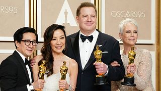 Ke Huy Quan, from left, Michelle Yeoh, Brendan Fraser and Jamie Lee Curtis pose with their awards in the press room at the Oscars 