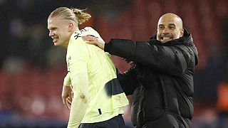 City's head coach Pep Guardiola, right, and City's Erling Haaland celebrate their victory over Crystal Palace, March, 11, 2023.