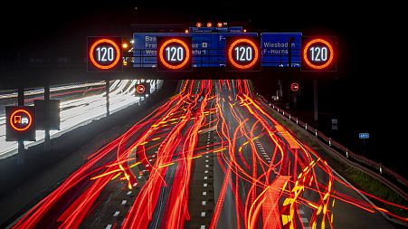 A long exposure photo shows traffic moving along a highway in Frankfurt, Germany, Oct. 6, 2022.