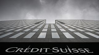 Grey clouds cover the sky over a building of the Credit Suisse bank in Zurich, Switzerland.