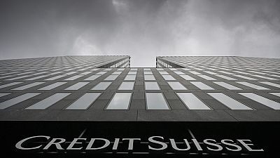 Grey clouds cover the sky over a building of the Credit Suisse bank in Zurich, Switzerland.