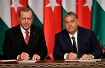 FILE: Turkish President Recep Tayyip Erdogan, left, and Hungarian Prime Minister Viktor Orban sign a document during their meeting in Budapest, Hungary, Thursday, Nov. 7, 2019