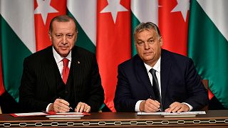 FILE: Turkish President Recep Tayyip Erdogan, left, and Hungarian Prime Minister Viktor Orban sign a document during their meeting in Budapest, Hungary, Thursday, Nov. 7, 2019