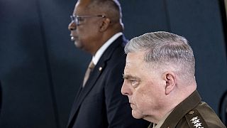 ecretary of Defense Lloyd Austin, left, accompanied by Chairman of the Joint Chiefs, Gen. Mark Milley, right in Washington, Wednesday, March 15, 2023.