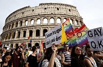 People march past the Colosseum during the Gay Pride parade in Rome, June 11, 2016.  