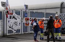 Municipality workers block the entrance of a waste incarnation plant in Paris, Friday, March 17, 2023. 