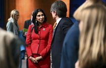 Britain's Home Secretary Suella Braverman speaks with members of the media after a press conference following the launch of new legislation on migrant channel crossings at Dow
