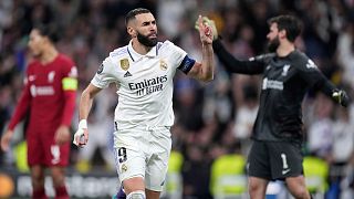 Real Madrid's Karim Benzema celebrates after scoring his sides first goal during the Champions League, round of 16, second leg soccer match between Real Madrid and Liverpool