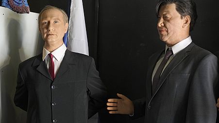 Wax figures depicting Russian President Vladimir Putin and Chinese President Xi Jinping at a museum in St. Petersburg, Russia, Friday, March 17, 20