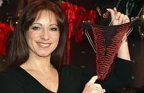 The late Jacqueline Gold holds underwear at one of her Ann Summers stores - FILE