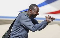 Freed French hostage journalist Olivier Dubois, who was held hostage in Mali for nearly two years, reacts upon his arrival at the military airport in Villacoublay, near Paris,