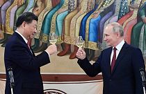 Putin and Xi drank champagne during the trip. 