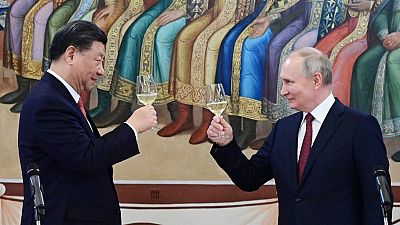 Putin and Xi drank champagne during the trip. 