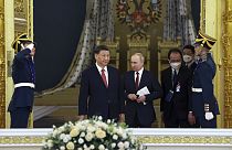 Vladímir Putin junto a Xi Jinping