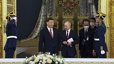 Vladímir Putin junto a Xi Jinping