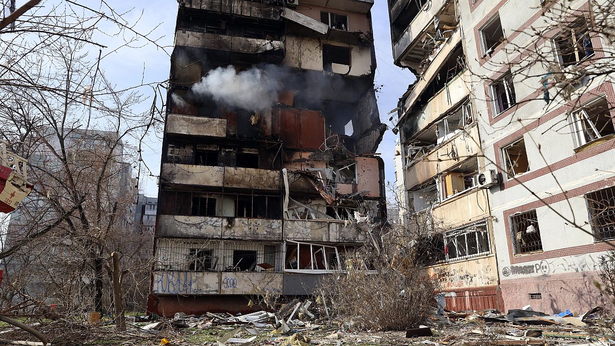 A residential multi-story building is seen damaged after a Russian missile hit it in southeastern city of Zaporizhzhia, Ukraine, March 22, 2023.