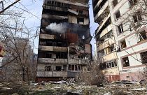 A residential multi-story building is seen damaged after a Russian missile hit it in southeastern city of Zaporizhzhia, Ukraine, March 22, 2023.