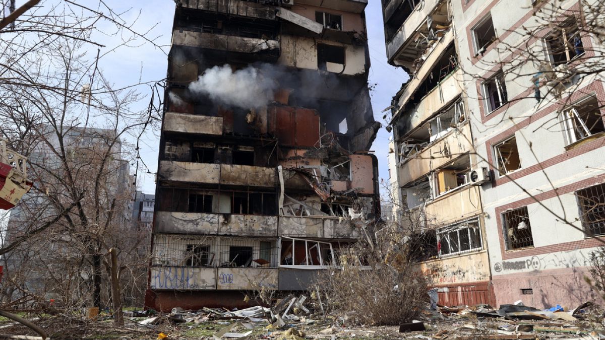 A residential multi-story building is seen damaged after a Russian missile hit it in southeastern city of Zaporizhzhia, Ukraine, Wednesday, March 22, 2023.