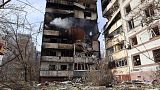 A residential multi-story building is seen damaged after a Russian missile hit it in southeastern city of Zaporizhzhia, Ukraine, Wednesday, March 22, 2023.
