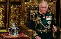 FILE - Prince Charles is seated next to the Queen's crown during the State Opening of Parliament, at the Palace of Westminster in London, Tuesday, May 10, 2022.