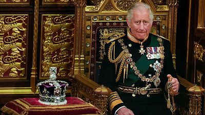 FILE - Prince Charles is seated next to the Queen's crown during the State Opening of Parliament, at the Palace of Westminster in London, Tuesday, May 10, 2022.