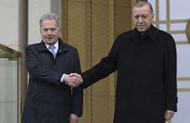 Turkish President Recep Tayyip Erdogan, right, and Finland's President Sauli Niinisto shake hands during a welcome ceremony at the presidential palace in Ankara, Turkey, Frida