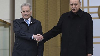 Turkish President Recep Tayyip Erdogan, right, and Finland's President Sauli Niinisto shake hands during a welcome ceremony at the presidential palace in Ankara, Turkey, Frida