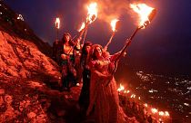 People carry torches during Nowruz celebrations - Akra, Iraq