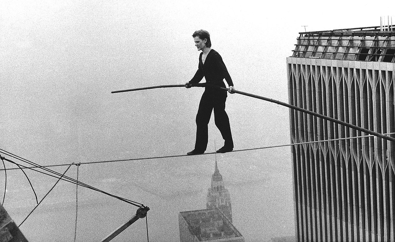 Philippe Petit walks across a tightrope suspended between the World Trade Center's Twin Towers in New York. Aug. 7, 1974