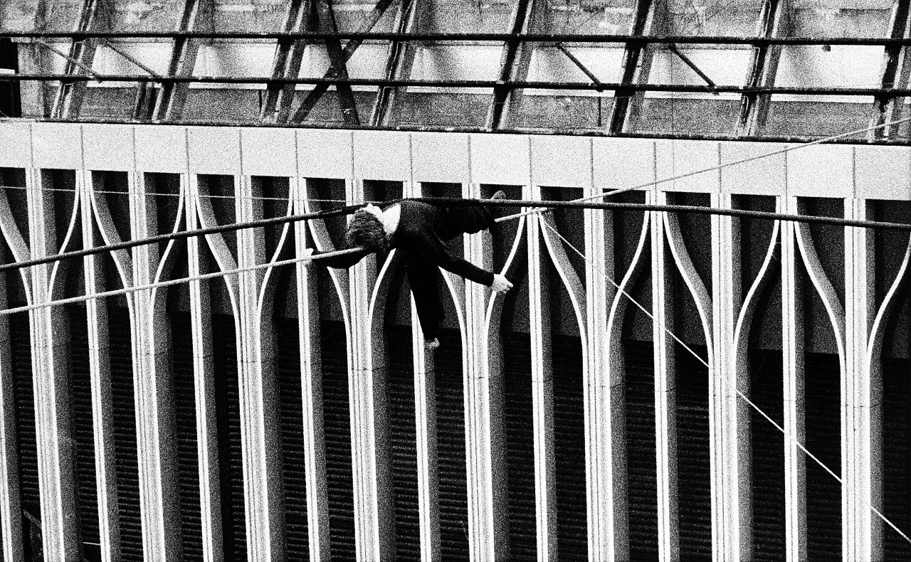Philippe Petit, lies across a cable stretched between New York's World Trade Center twin towers, Aug. 7, 1974.