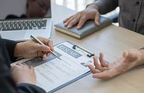 A recruiter and an interviewee during a recruitment process.