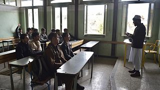 Afghan school boys attend their first classes at Esteqlal High School in Kabul on March 25, 2023, after missing the official start of the new academic year