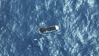 FILE: image by German humanitarian organisation Sea-watch shows a boat carrying a group of migrants in distress in the Southern Mediterranean Sea, March 11, 2023